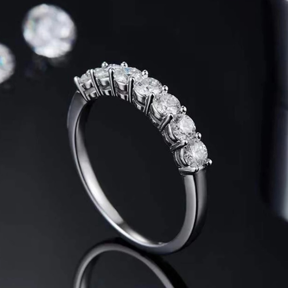 7 genuine moissanite stone .7 tcw on size 5 .925 band